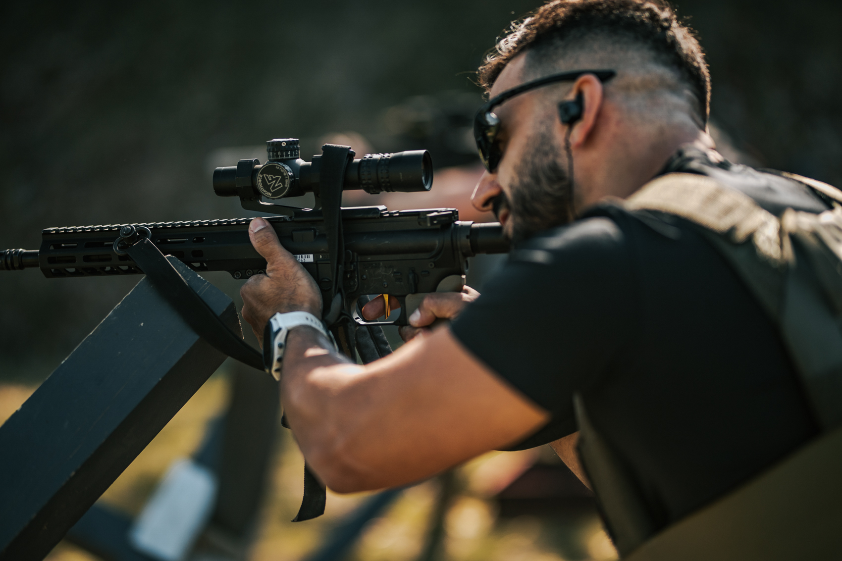Competitor firing from a barricade during a Tactical Games stage