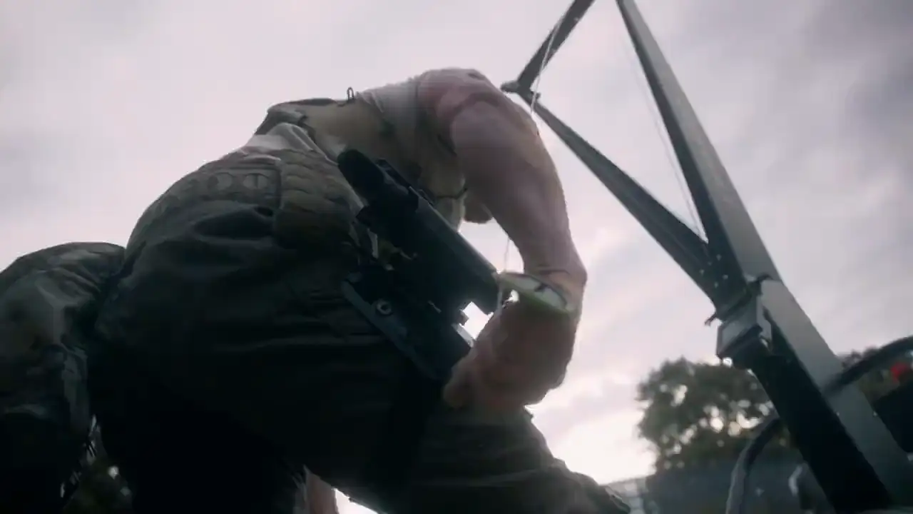 Tactical Games competitor moving through an obstacle with a rifle