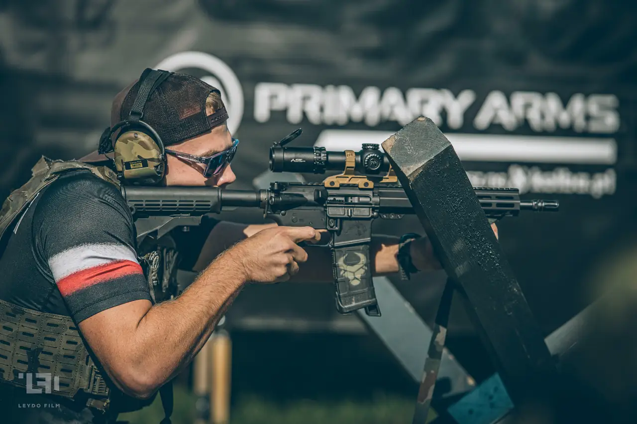 Tactical Games range officer checking a competitor's rifle for safety